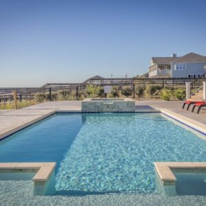 Journal Stunning infinity pool at a seaside resort, perfect for relaxation and leisure travel.
